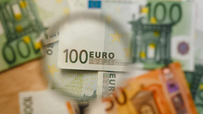 eur-bank-notes-magnifying-glass - EUR